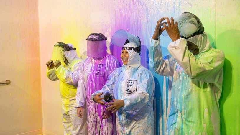 A team is splattered with paint at Beat the Bomb in Atlanta on Saturday, Oct. 15, 2022. The Brooklyn-based immersive escape room experience recently opened its Atlanta location. (Photo by Jenn Finch)