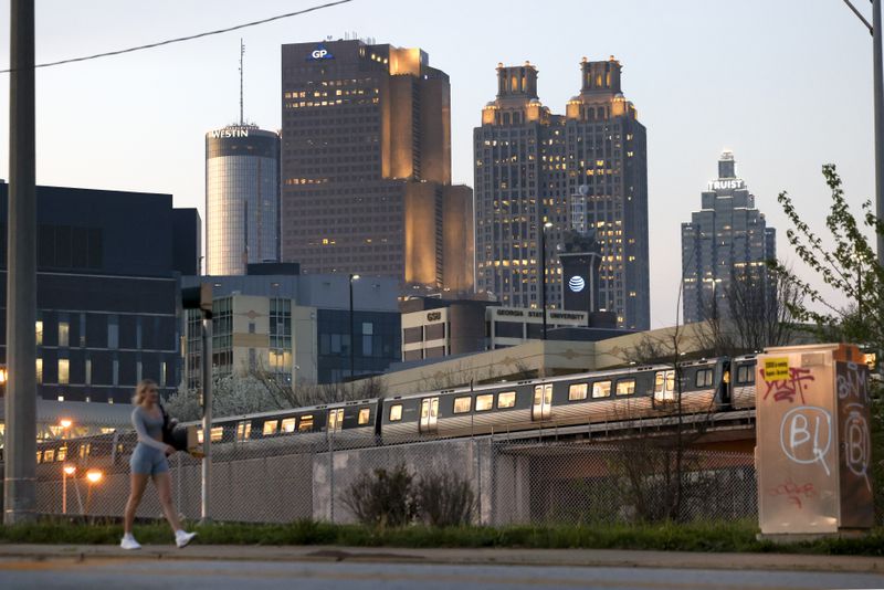 The Atlanta skyline as a train leaves the Georgia State MARTA Station.
