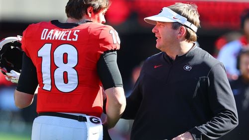 Georgia head coach Kirby Smart and quarterback JT Daniels confer during the second quarter against Charleston Southern in a NCAA college football game on Saturday, Nov. 20, 2021, in Athens.    “Curtis Compton / Curtis.Compton@ajc.com”