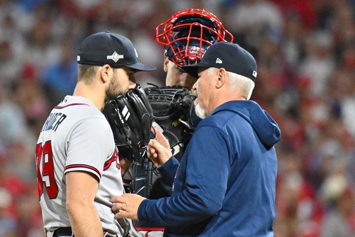 Atlanta Braves starting pitcher Spencer Strider (99) is settled down by pitching coach Rick Kranitz after giving up a solo home run to Philadelphia Phillies’ Trea Turner during the fifth inning of NLDS Game 4 at Citizens Bank Park in Philadelphia on Thursday, Oct. 12, 2023.   (Hyosub Shin / Hyosub.Shin@ajc.com)