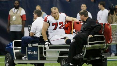 Atlanta Falcons' Sam Baker (72) leaves on a cart after he was injured during the second quarter of an NFL preseason football game against the Houston Texans, Saturday, Aug. 16, 2014, in Houston. (AP Photo/David J. Phillip)