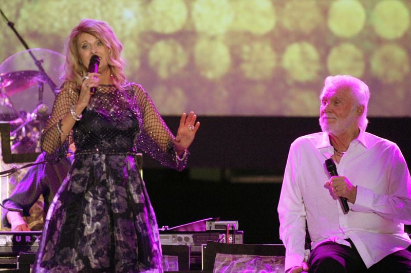 Longtime country singer Linda Davis joined Rogers throughout his show. (Akili-Casundria Ramsess/Special to the AJC)