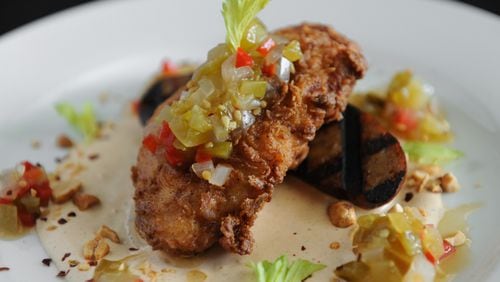 Grilled Louisiana andouille sausage with fried chicken, Cajun remoulade, chow-chow, peanuts and celery at Antebellum. (Contributed by Becky Stein)
