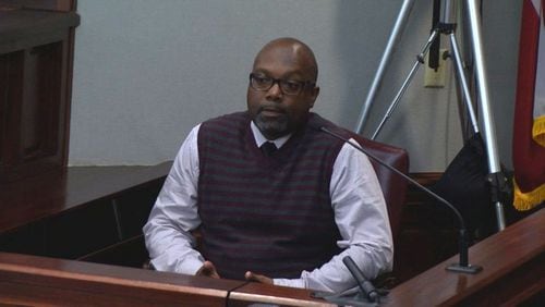 Wesley Houston, a corporate security officer for Home Depot, testifies at at Justin Ross Harris' murder trial at the Glynn County Courthouse in Brunswick, Ga., on Wednesday, Oct. 13, 2016. Houston described seeing Leanna Taylor reacting to a breaking-news alert about Cooper. (screen capture via WSB-TV)
