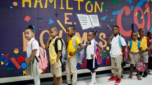 8/6/18 - East Point -  Students wait in line to be taken to their classrooms.  It was the first day of school at Hamilton E. Holmes Elementary in East Point.  Members of the 100 Black Men of Atlanta were on hand to greet students.    BOB ANDRES  /BANDRES@AJC.COM