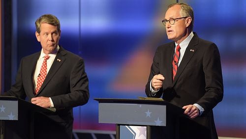 Lt. Gov. Casey Cagle, right, responds to Secretary of State Brian Kemp's remarks about his office's role in the investigations of sexual misconduct complaints, which took place at two Massage Envy clinics, during the second and final televised debate at a Channel 2 Action News studio on Sunday, July 15. Cagle says that Kemp is diverting accountability for the complaints when "it is (Kemp's) responsibility." The runoff to decide the Republican candidate for governor will be held July 24.