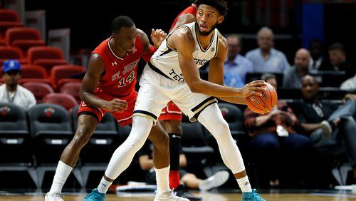 MIAMI, FL - DECEMBER 01:  James Banks III #1 of the Georgia Tech Yellow Jackets is defended by Mustapha Heron #14 of the St. John's Red Storm during the first half of the HoopHall Miami Invitational at American Airlines Arena on December 1, 2018 in Miami, Florida.  (Photo by Michael Reaves/Getty Images)