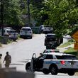 Police investigate the scene where multiple law enforcement officers were shot on April 29 in east Charlotte. (Khadejeh Nikouyeh/The Charlotte Observer/TNS)
