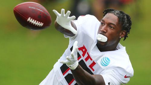 Falcons top receiver Calvin Ridley catches a pass in the end zone while running pass routes during the first training camp practice in pads Tuesday, Aug. 3, 2021, in Flowery Branch. (Curtis Compton / Curtis.Compton@ajc.com)