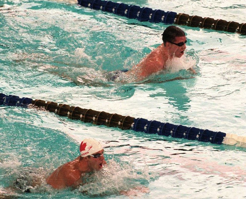 Midway through the men's 400m heat 4, USA's Tom Dolan (top) catches Canada's Curtis Myden (bottom) at the Georgia Tech Aquatic Center, Sunday, July 21, 1996 during the 1996 Summer Olympic Games in Atlanta, Georgia. Dolan finished 2nd in the heat. (E. A. Kennedy III/AJC)