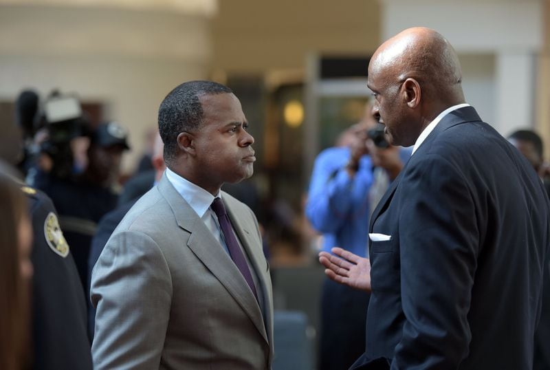 Miguel Southwell, right, then the general manager of Hartsfield-Jackson International Airport, talks with then-Atlanta Mayor Kasim Reed following an airport press conference in November 2015. KENT D. JOHNSON/KDJOHNSON@AJC.COM