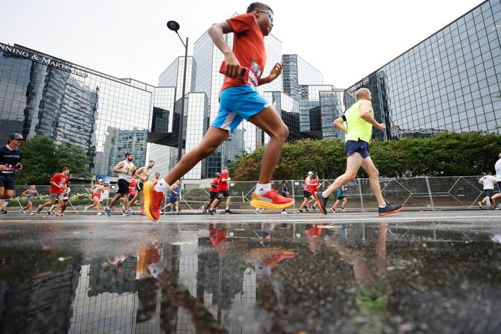 Runners take part in the 54th running of the Atlanta Journal-Constitution Peachtree Road Race in Atlanta on Tuesday, July 4th, 2023.   (Miguel Martinez / Miguel.Martinezjimenez@ajc.com)