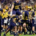 Michigan celebrates after their win against Washington in the national championship NCAA College Football Playoff game Monday, Jan. 8, 2024, in Houston.  Michigan won 34-13. (AP Photo/Eric Gay)