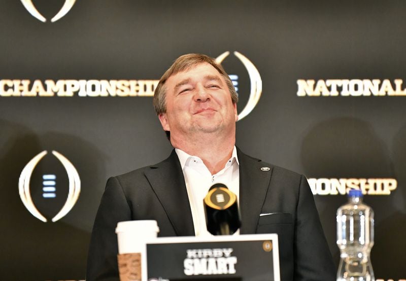 Georgia's head coach Kirby Smart reacts as quarterback Stetson Bennett (not pictured) speaks during Champions News Conference in Indianapolis on Tuesday, January 11, 2022. (Hyosub Shin / Hyosub.Shin@ajc.com)
