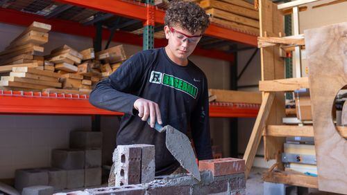 Students in Roswell High's construction classes have been working side by side with industry experts who have volunteered to teach the class.