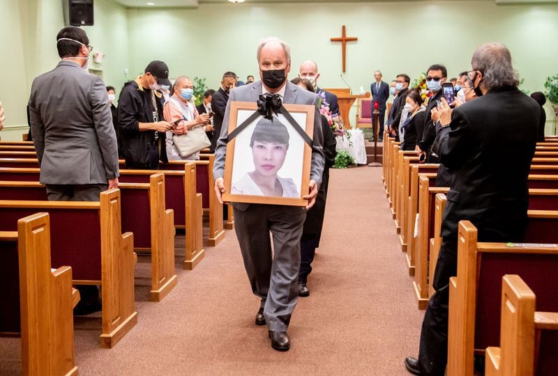 A photograph of Daoyou Feng is carried out of Lee's Funeral Home after her funeral in Norcross on Sunday, April 4, 2021. The 44-year-old was among the eight people slain in metro Atlanta spa shootings last month. She was from China and had no known family in the U.S. (Photo: Steve Schaefer for The Atlanta Journal-Constitution)