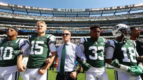 EAST RUTHERFORD, NJ - SEPTEMBER 24:  Jermaine Kearse #10, Josh McCown #15, Jamal Adams #33, ArDarius Stewart #18 and Christopher Johnson CEO of the New York Jets stand in unison with his team during the National Anthem prior to an NFL game against the Miami Dolphins at MetLife Stadium on September 24, 2017 in East Rutherford, New Jersey.  (Photo by Al Bello/Getty Images)