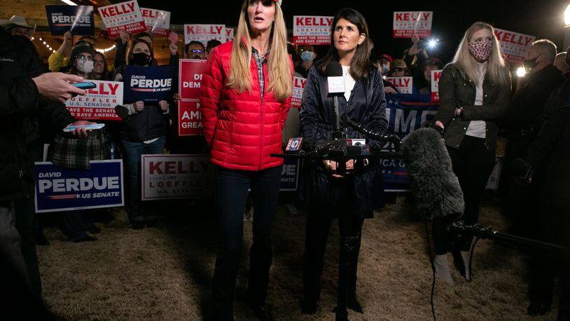 Georgia Republican Senate candidate Kelly Loeffler (R-GA) and former U.N. Ambassador Nikki Haley (R) take questions from the media during a rally on Dec. 20, 2020 in Cumming, Georgia. (Jessica McGowan/Getty Images/TNS) 
