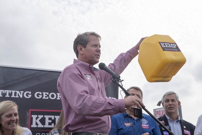 Georgia Republican Gubernatorial candidate Brian Kemp encourages his supporters to donate funds to his campaign by filling up a diesel gas can during a stop at Appalachian Gun, Pawn & Range in Jasper on Oct. 1. It was the first day of a weeklong bus tour where  his campaign visited 27 counties in 5 days. (ALYSSA POINTER/ALYSSA.POINTER@AJC.COM)