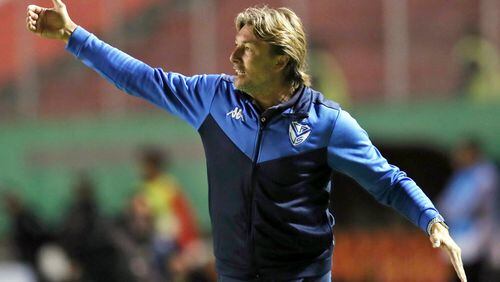 FILE - In this Feb. 18, 2020, file photo, Velez Sarsfield coach Gabriel Heinze directs his players during a Copa Sudamericana soccer match against Aucas at the Gonzalo Pozo Ripalda stadium in Quito, Ecuador.  Hoping to recreate the success of its first coach, Atlanta United hired Argentina's Gabriel Heinze on Friday, Dec. 18, 2020, to manage the Five Stripes, who endured a miserable season just two years after winning the MLS Cup championship. (AP Photo/Dolores Ochoa, File)