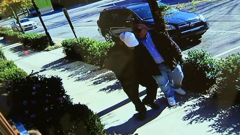 Police say these men were wearing professional-grade masks when they were buzzed into a Brookhaven jewelry store around 11:20 a.m. Tuesday. (Credit: Channel 2 Action News)