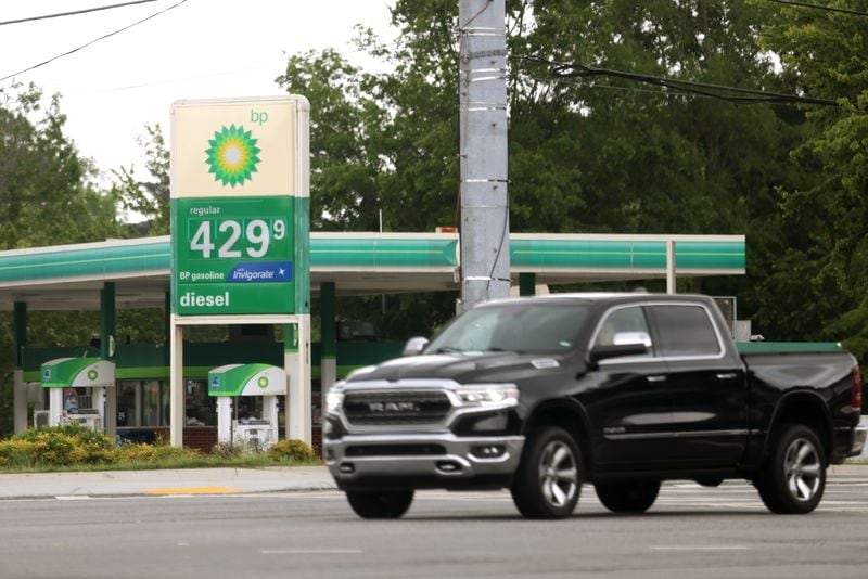 Gas prices have been unusually high, thanks to a mix of factors: The Russian attack on Ukraine, the shortage of U.S. refinery capacity and the sluggishness of oil companies to expand drilling. Here, a station on Medlock Bridge Road in Johns Creek on Wednesday,. (Jason Getz / Jason.Getz@ajc.com)