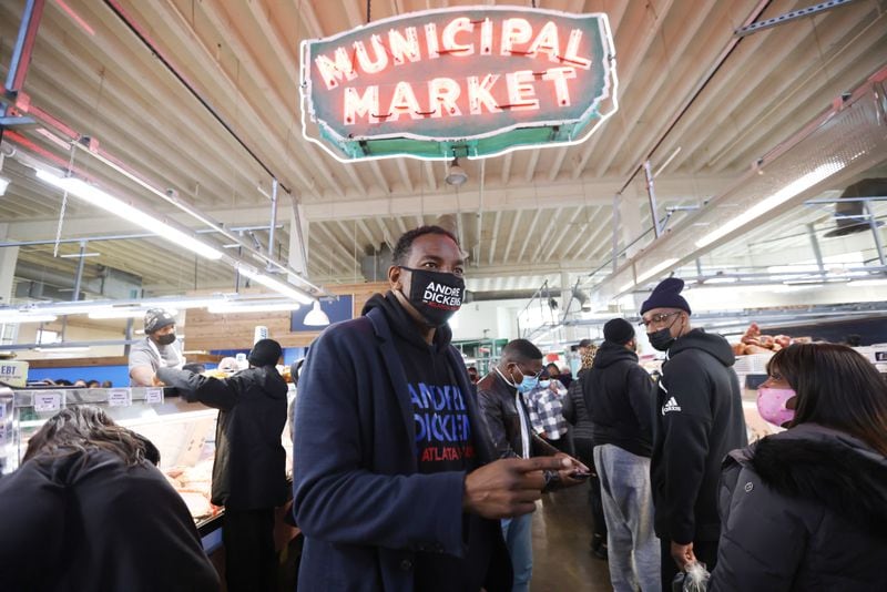 At his second stop of the day, Atlanta mayoral candidate Andre Dickens campaigned at Sweet Auburn Curb Market. He has walked the aisles and talked to market customers, reminding them to vote. Saturday, November 20, 2021. Miguel Martinez for The Atlanta Journal-Constitution
