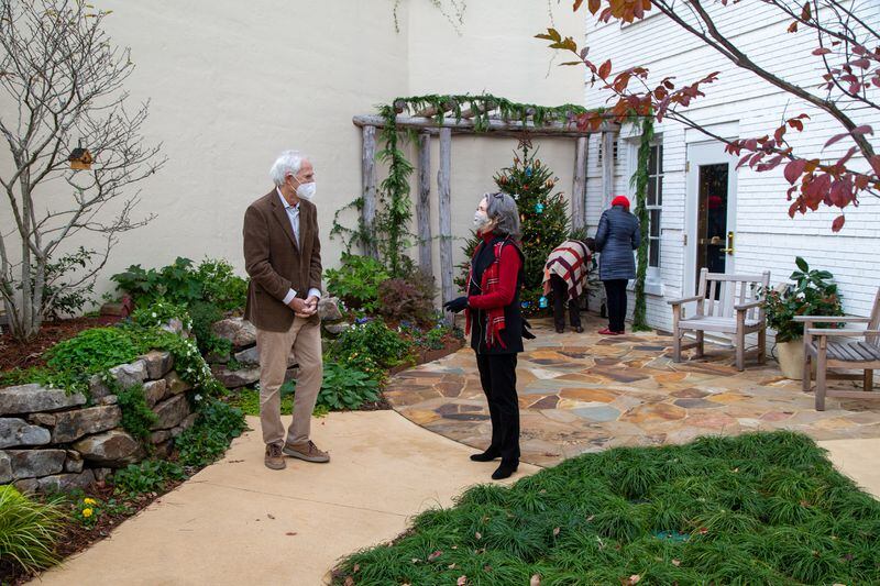 Sandy Gruskin (from left) talks with Carter Morris while Virginia Almand and Linda Gruskin look at the Christmas tree in the Therapeutic Garden, called Sarahs' Garden. PHIL SKINNER FOR THE ATLANTA JOURNAL-CONSTITUTION.