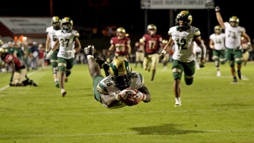 Grayson running back Phil Mafah (26) dives into the end zone to complete an 82-yard TD catch in Friday's 58-17 victory over Brookwood.