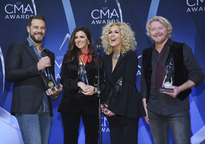  Little Big Town, from left, Jimi Westbrook, Karen Fairchild, Kimberly Schlapman and Phillip Sweet with the award for vocal group of the year. (Photo by Evan Agostini/Invision/AP)