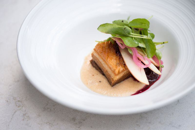  Heritage Pork Belly Appetizer with smoked Gala apple butter, wild berry jam, and watercress. Photo credit- Mia Yakel.