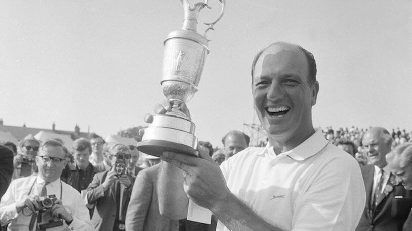 In this July 15, 1967, file photo, Roberto De Vincenzo of Buenos Aires, Argentina, holds the trophy following his victory at Hoylake, England. De Vincenzo shot a 278 for the 72 holes of championship play. This is the 50-year anniversary of the Argentine winning the British Open. (AP Photo/File)