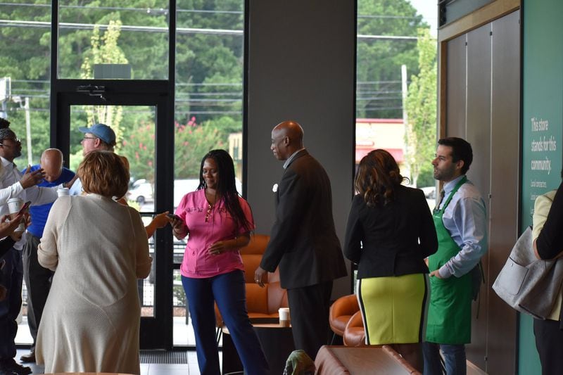 Clayton County residents celebrate the opening of the new Starbucks “community” store in Jonesboro. PHOTO: LEON STAFFORD