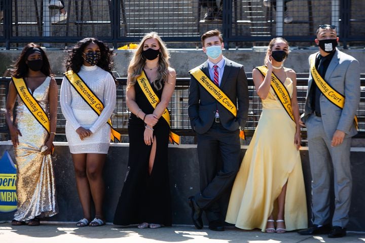 Members of the Kennesaw State homecoming court wait on the sidelines during the game. CHRISTINA MATACOTTA FOR THE ATLANTA JOURNAL-CONSTITUTION.