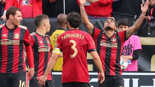 Atlanta United forward Josef Martinez (right) celebrates his second of his two goals against the Chicago Fire for a 4-0 victory on Saturday, March 18, 2017, in Atlanta. (Curtis Compton/ccompton@ajc.com)