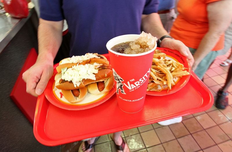 100822 Atlanta - Joshua Sieweke, Decatur, goes with slaw dogs, fries and a coke for his final order at the Varsity Jr. in Atlanta on Sunday, August, 22, 2010.  Curtis Compton  ccompton@ajc.com