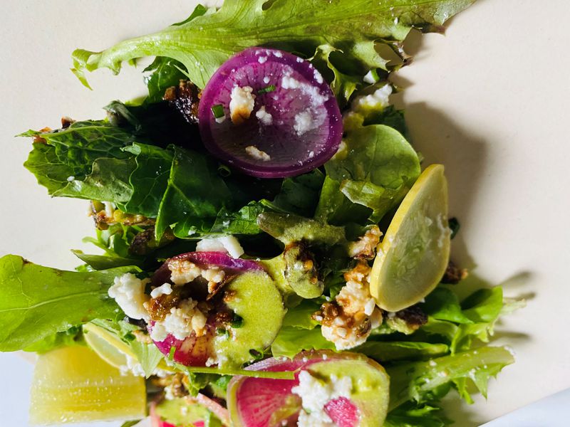 This green salad, with pistachio, cashew green goddess, feta, radish and squash, came from Kimball House. Bob Townsend for The Atlanta Journal-Constitution
