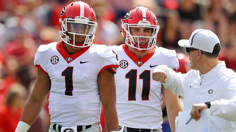 Georgia quarterbacks Jake Fromm and Justin Fields prepare to play in the annual G-Day spring intrasquad football game on Saturday, April 21, 2018, in Athens. Curtis Compton/ccompton@ajc.com