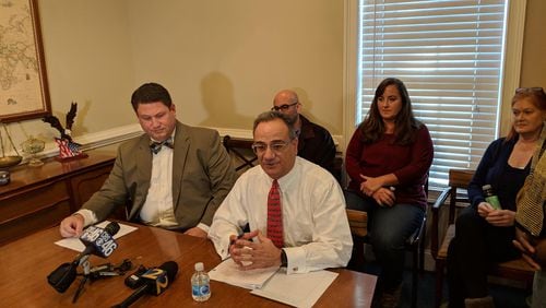 Jan. 11, 2019, Marietta – Lawyer Rob Madayag (seated left) with lawyer Mitch Skandalakis, speaking about bullying in Cobb County, with the parents of alleged victims seated behind.