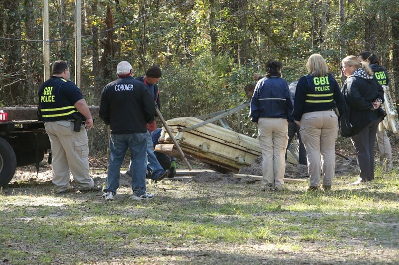 11/18/2020 - Spring Bluff, Georgia: The GBI exhumes the body of Harold Swain, who was murdered inside Rising Daughter Baptist Church along with his wife Thelma. (Tyson Horne / Tyson.Horne@ajc.com)