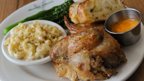 1/4 Carolina Chicken with sauteed broccolini and garlic, aged cheddar mac & cheese and jalapeno cheddar bread at Bantam & Biddy. (Contributed by Becky Stein)