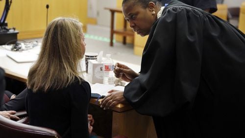 Judge Tammy Kemp opened a Bible to John 3:16 and gave it to Amber Guyger. She also gave her some words of encouragement to do something with her life following the 10-year sentence at the Frank Crowley Courts Building in Dallas on Oct. 2, 2019. (Tom Fox/Dallas Morning News/Pool/TNS)