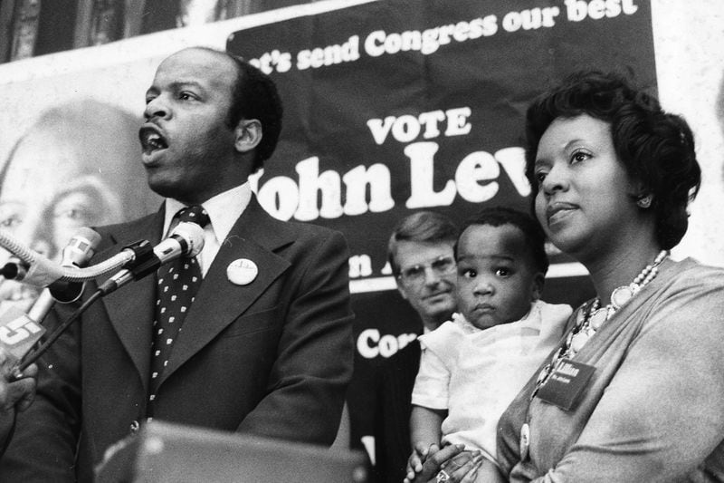 John Lewis began his political career in 1977 with a defeat. Lewis saw his opportunity when President Jimmy Carter appointed Andrew Young as the U.S. ambassador to the United Nations, which forced Young to vacate his 5th Congressional District seat. Lewis' plans to replace Young as congressman for the 5th District were foiled however by Wyche Fowler Jr., who defeated Lewis by 24 percentage points. Carter would later appoint Lewis as associate director of ACTION, a federal volunteer agency. In this photo, Lewis is joined at a campaign rally by his wife Lillian and son John-Miles, with Zell Miller in the background. (Dwight Ross Jr. / AJC file)