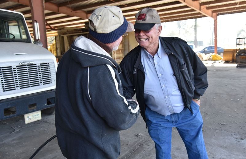 Rex Bullock got his first taste of political involvement in 2002, when he hosted an event on his farm for gubernatorial candidate Sonny Perdue. In early 2016, he got help from T.R. Parker (left) who loaned Bullock a couple of wagons and some space at Pitts Gin Company to display the 30-foot Trump banner. HYOSUB SHIN / HSHIN@AJC.COM