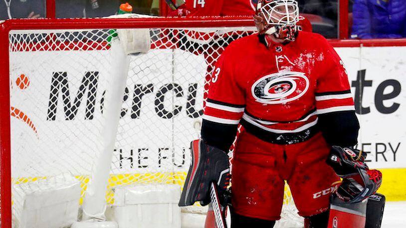 The Carolina Hurricanes&apos; Scott Darling (33) watches the replay on the scoreboard after he gave up a goal during the first period against the Edmonton Oilers at PNC Arena in Raleigh, N.C., on Tuesday, March 20, 2018. (Chris Seward/Raleigh News &amp; Observer/TNS)