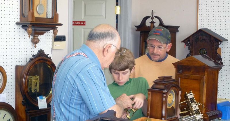 Thomas Bowers helps his grandson, Nick, learn the watch repair trade Bowers Watch & Clock Repair, with some help by Nick’s father, Tim. Courtesy of Bowers Watch & Clock Repair
