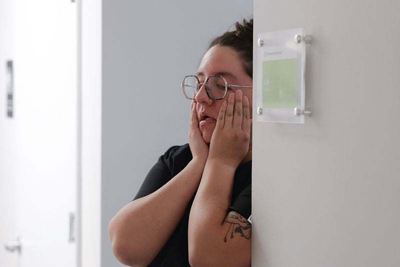Lexi Chang, a medical assistant at a Planned Parenthood clinic in Jacksonville, Florida, takes a moment to herself earlier this month. On a recent day, the clinic had 28 first-day consults, 21 surgical abortions and six medication abortions. (Natrice Miller/natrice.miller@ajc.com)