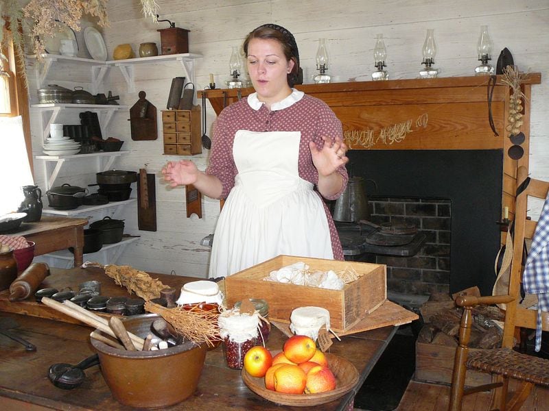 Root House volunteer Katie Gobbi explains to visitors at the Marietta museum how an 1850s middle-class family prepared food.