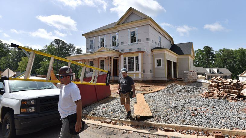 Work underway last summer on a 4,700 square foot house in Goulding Historic Roswell. The Atlanta market is moving in different directions, with shortages of smaller, more affordable properties for first-time buyers and a big supply of higher-priced homes.HYOSUB SHIN / HSHIN@AJC.COM