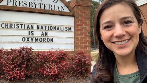 Pastor Catherine Renken posts messages on the marquee at Kirkwood Presbyterian Church in Kennesaw that spread the message about justice, love and the Word of Jesus. They have drawn complaints from some passersby. CONTRIBUTED